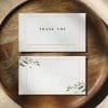 place cards on top of wooden plate